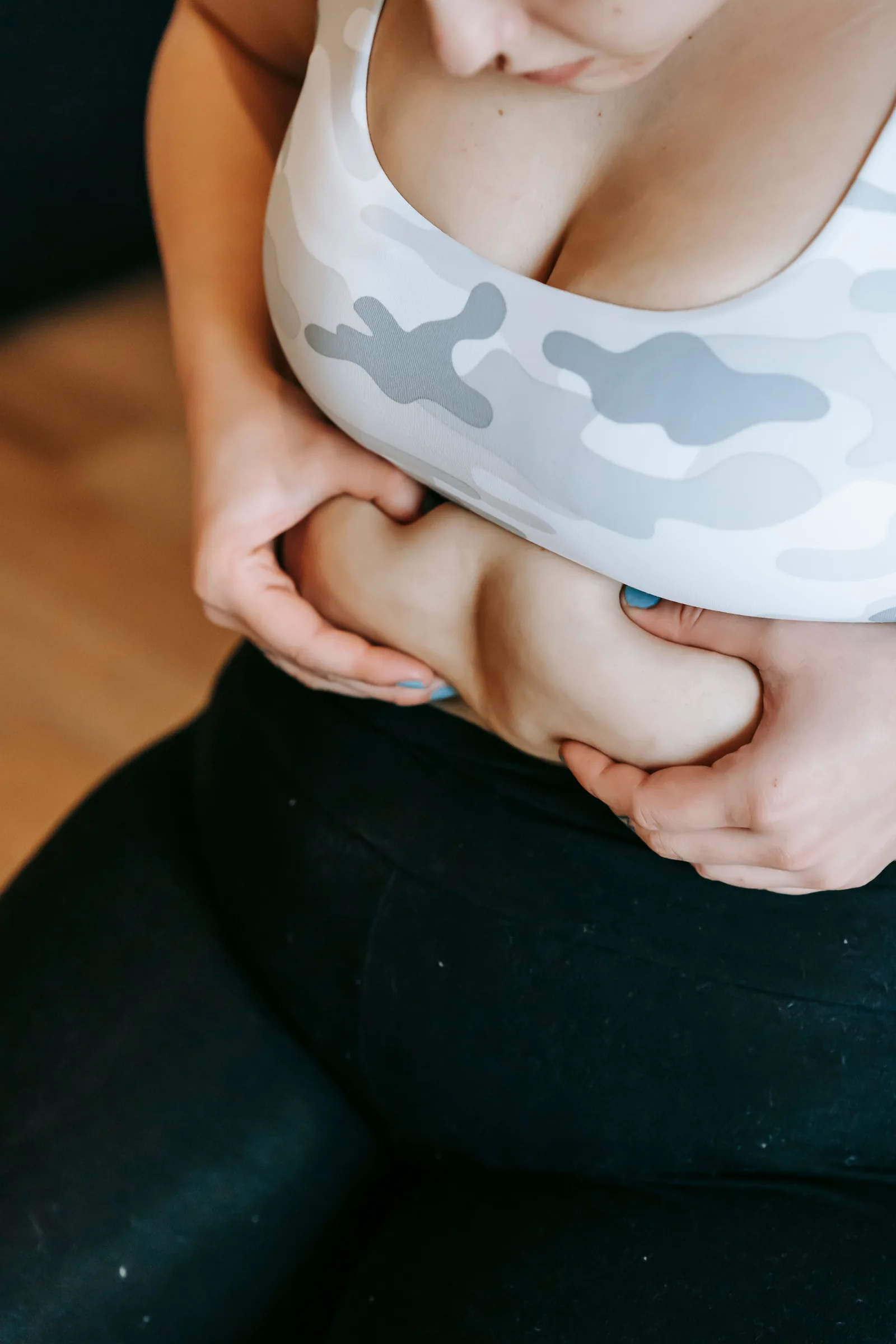 Holding the midsection while wearing activewear