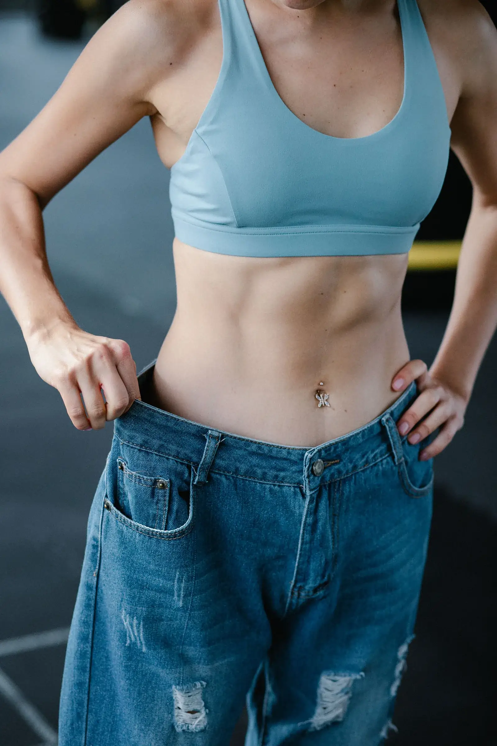 Loose jeans held open at the waist