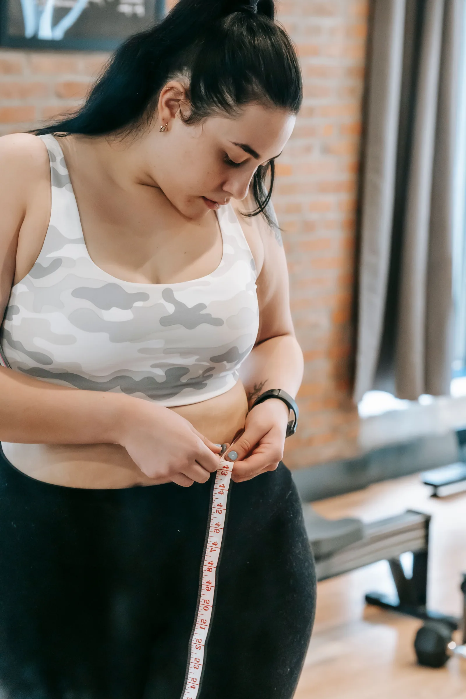 Measuring the waist in a gym studio