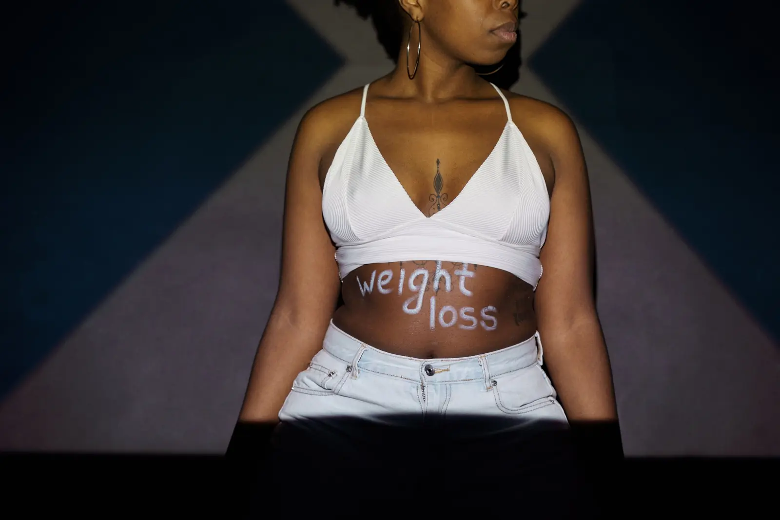 The words weight loss written across the midsection
